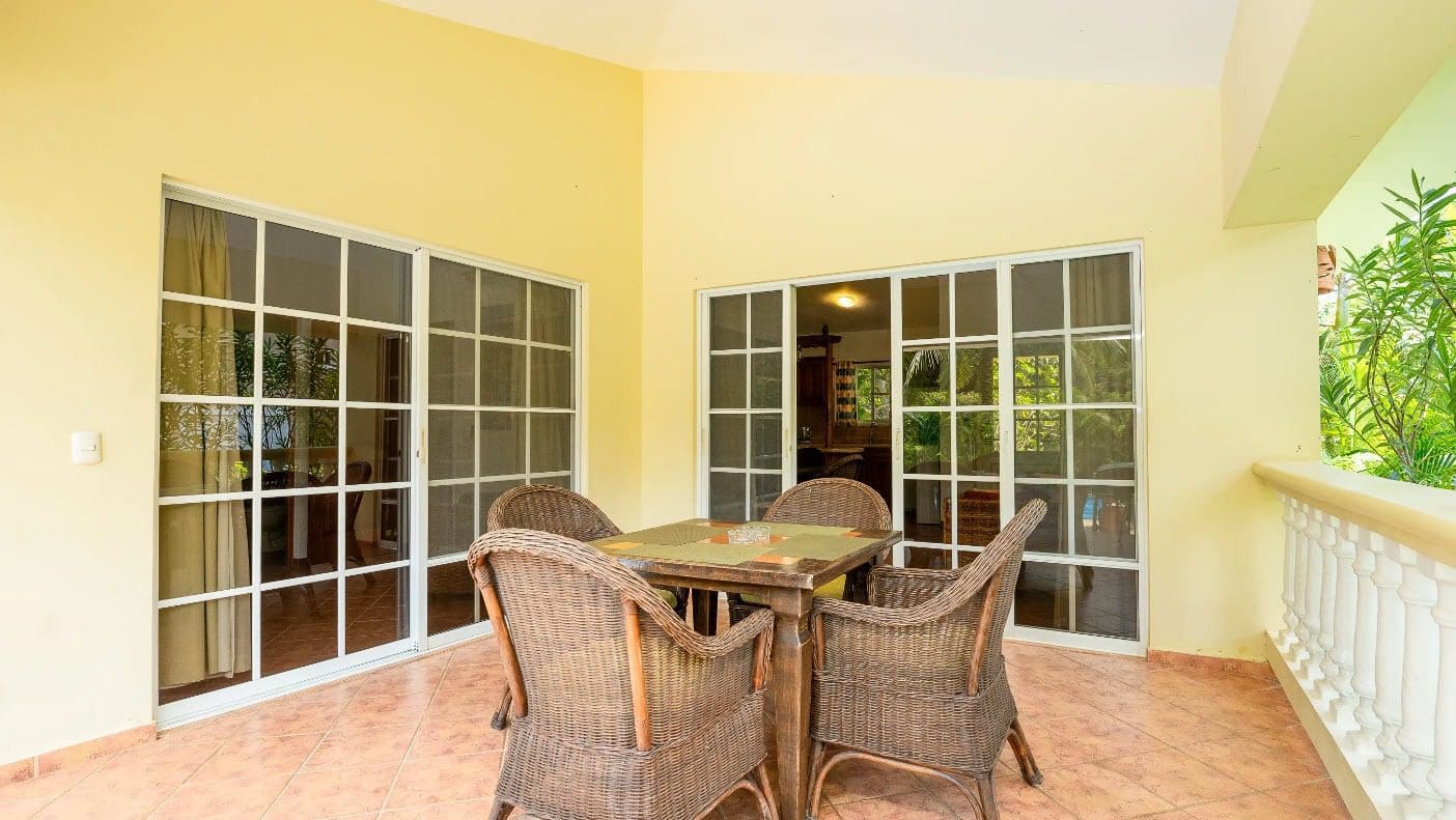buyDRproperty Outdoor patio with wicker furniture at a villa Sosua Real Estate
