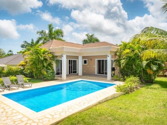 buyDRproperty Beautiful villa with pool for sale in gated community, sunny day Sosua Real Estate