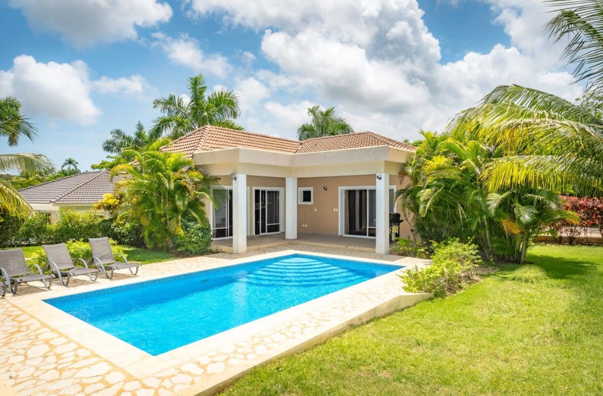 buyDRproperty Beautiful villa with pool for sale in gated community, sunny day Sosua Real Estate