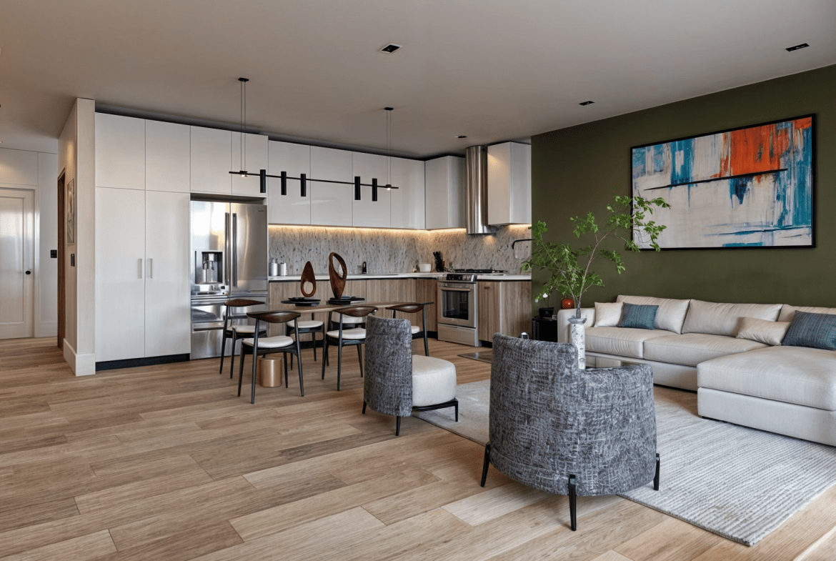 buyDRproperty Modern open-plan living space featuring a kitchen, dining area, and living room with hardwood floors. Sosua Real Estate