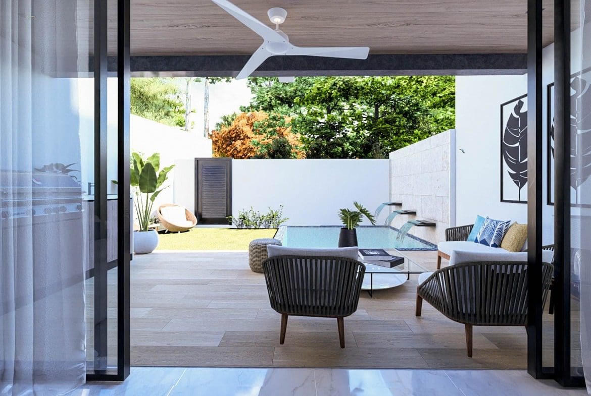 buyDRproperty Luxury outdoor patio with pool, seating area, and greenery, perfect for a SEPTEMBER DEAL beach home. Sosua Real Estate