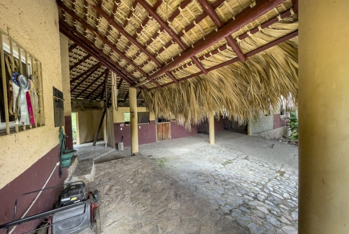 buyDRproperty Rustic building lot with thatched roof stables Sosua Real Estate
