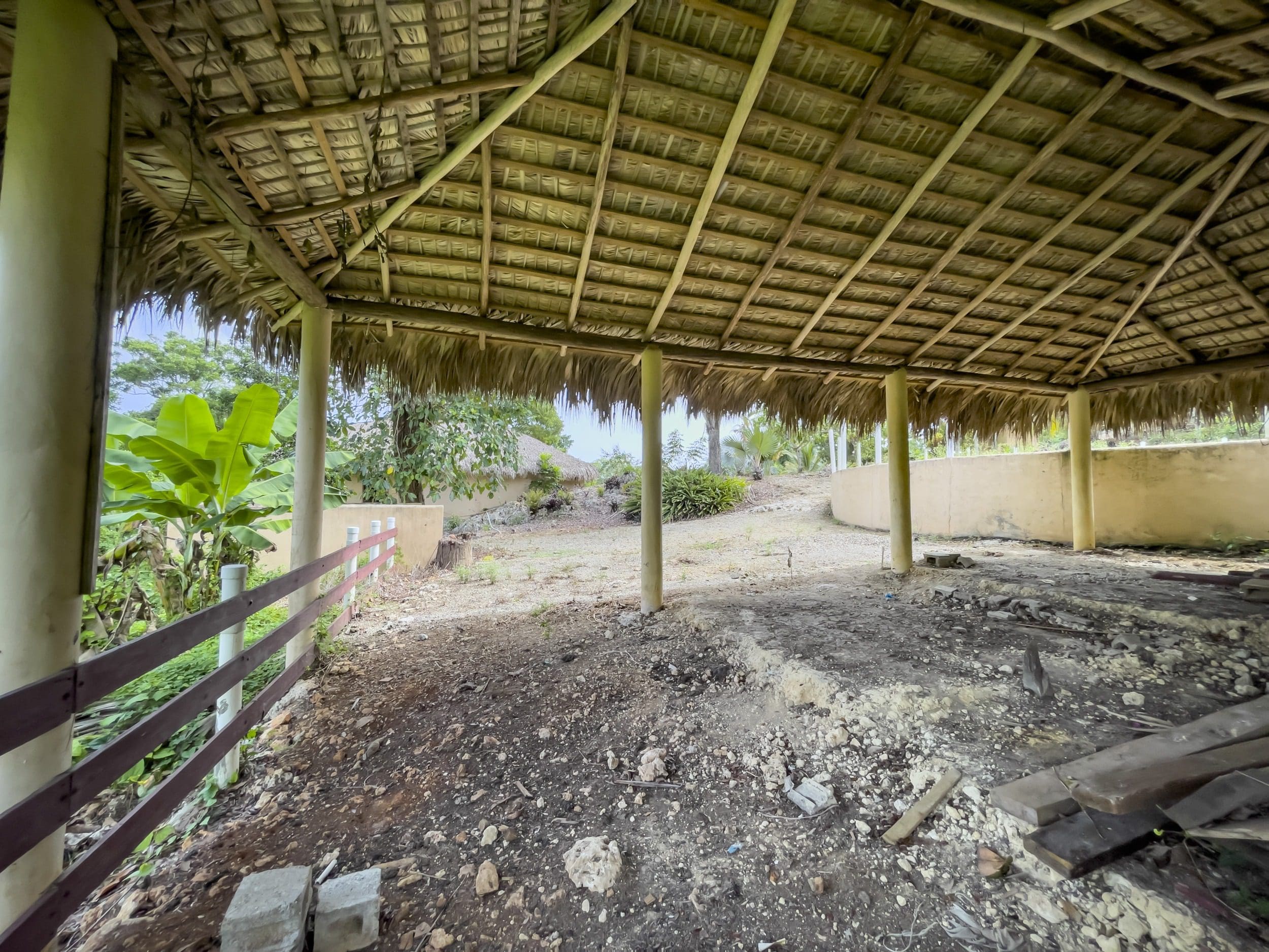 buyDRproperty Dilapidated structure with thatched roof. Building lot with dirt floor and fence. Sosua Real Estate