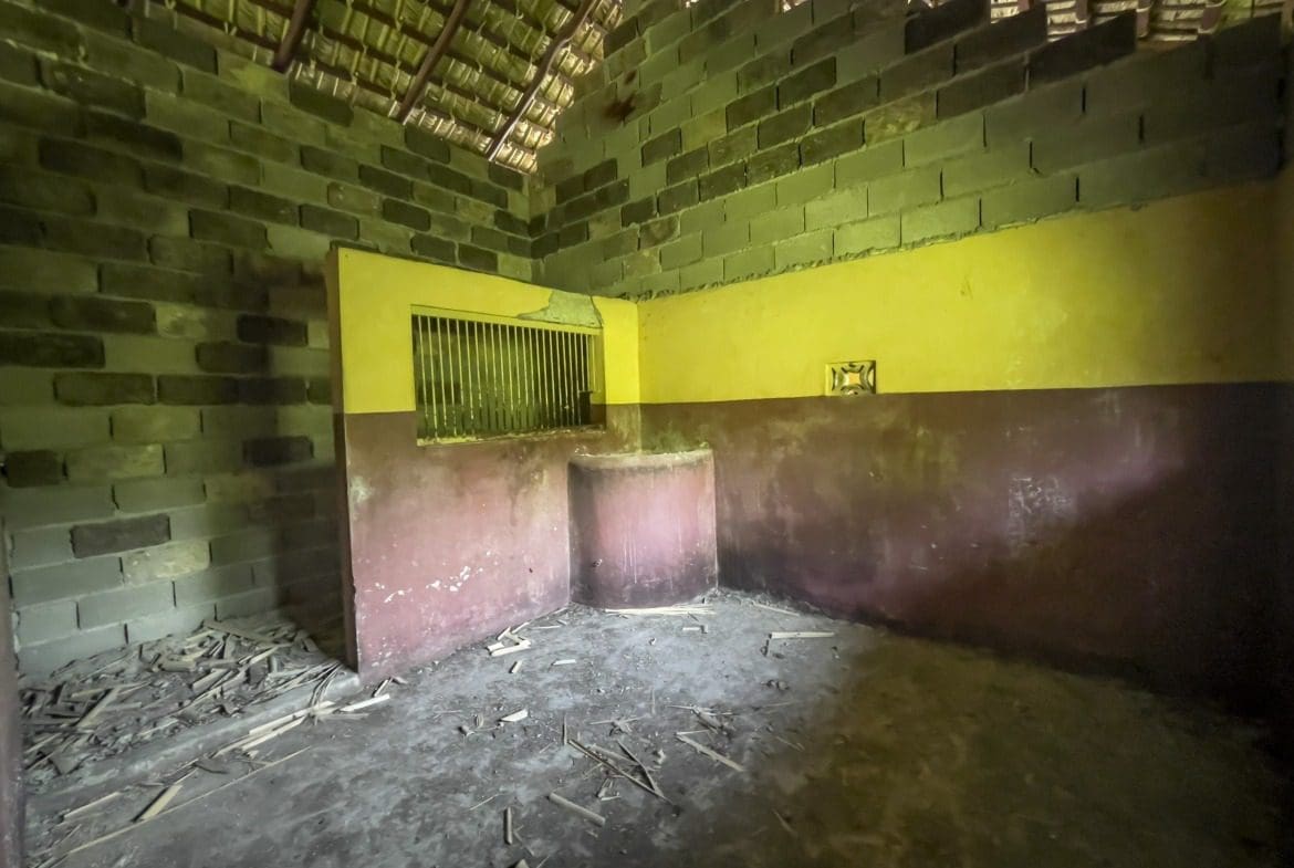 buyDRproperty Interior of a derelict building with a building lot. The building has brick walls and a thatched roof. Sosua Real Estate
