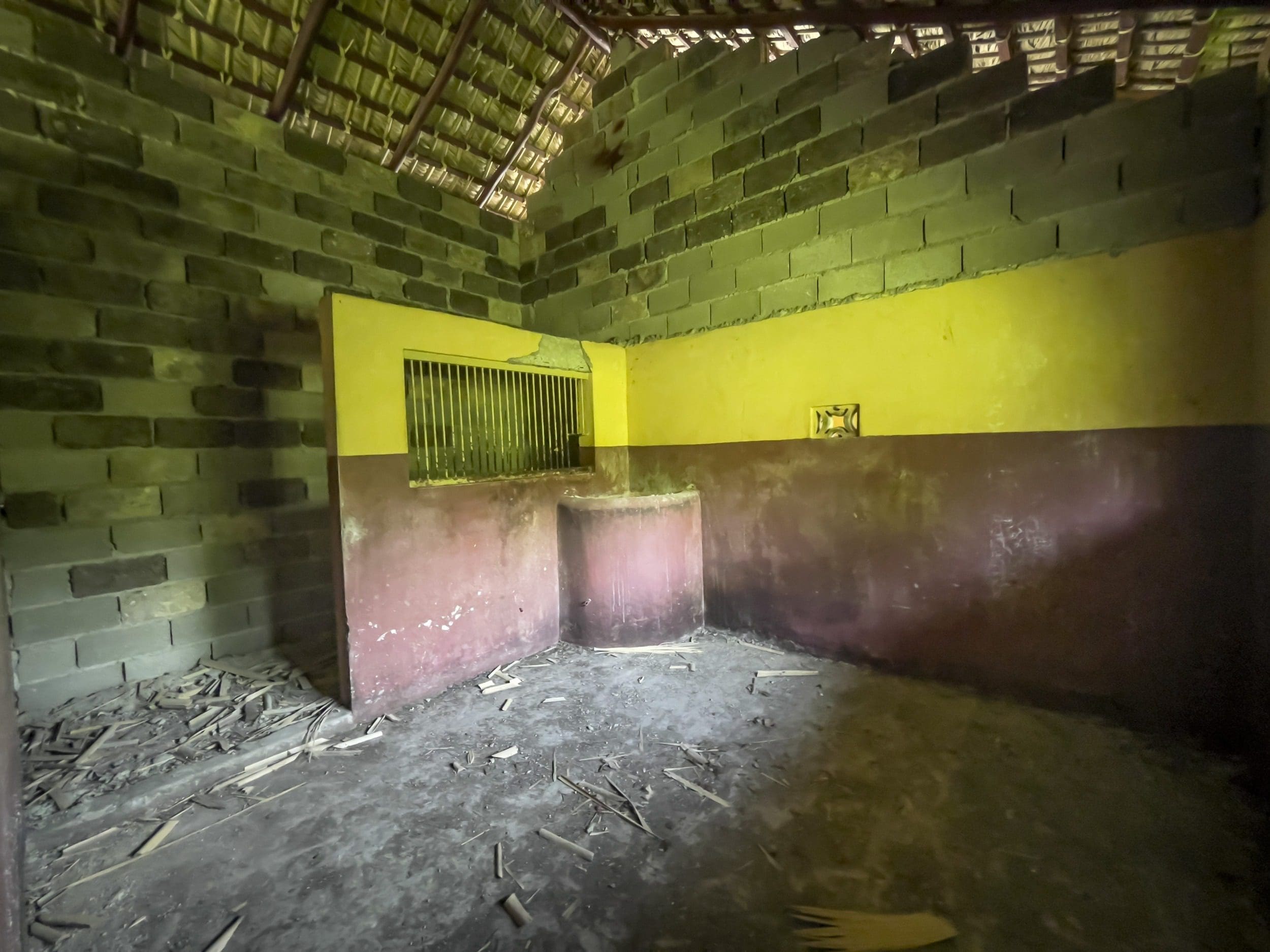 buyDRproperty Interior of a derelict building with a building lot. The building has brick walls and a thatched roof. Sosua Real Estate