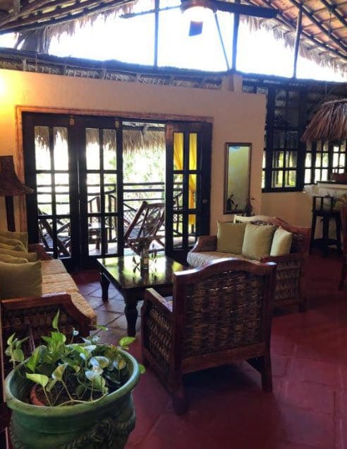buyDRproperty Cozy seating area in Hotel with open doors to balcony Sosua Real Estate
