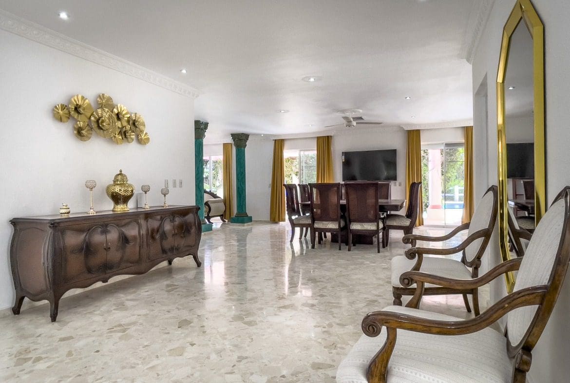 buyDRproperty Spacious living room with marble floors and elegant furniture in a prime villa for sale. Sosua Real Estate