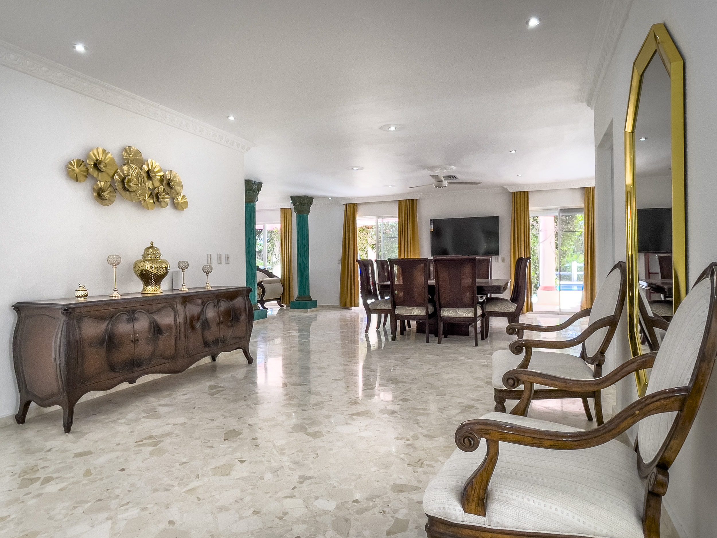buyDRproperty Spacious living room with marble floors and elegant furniture in a prime villa for sale. Sosua Real Estate