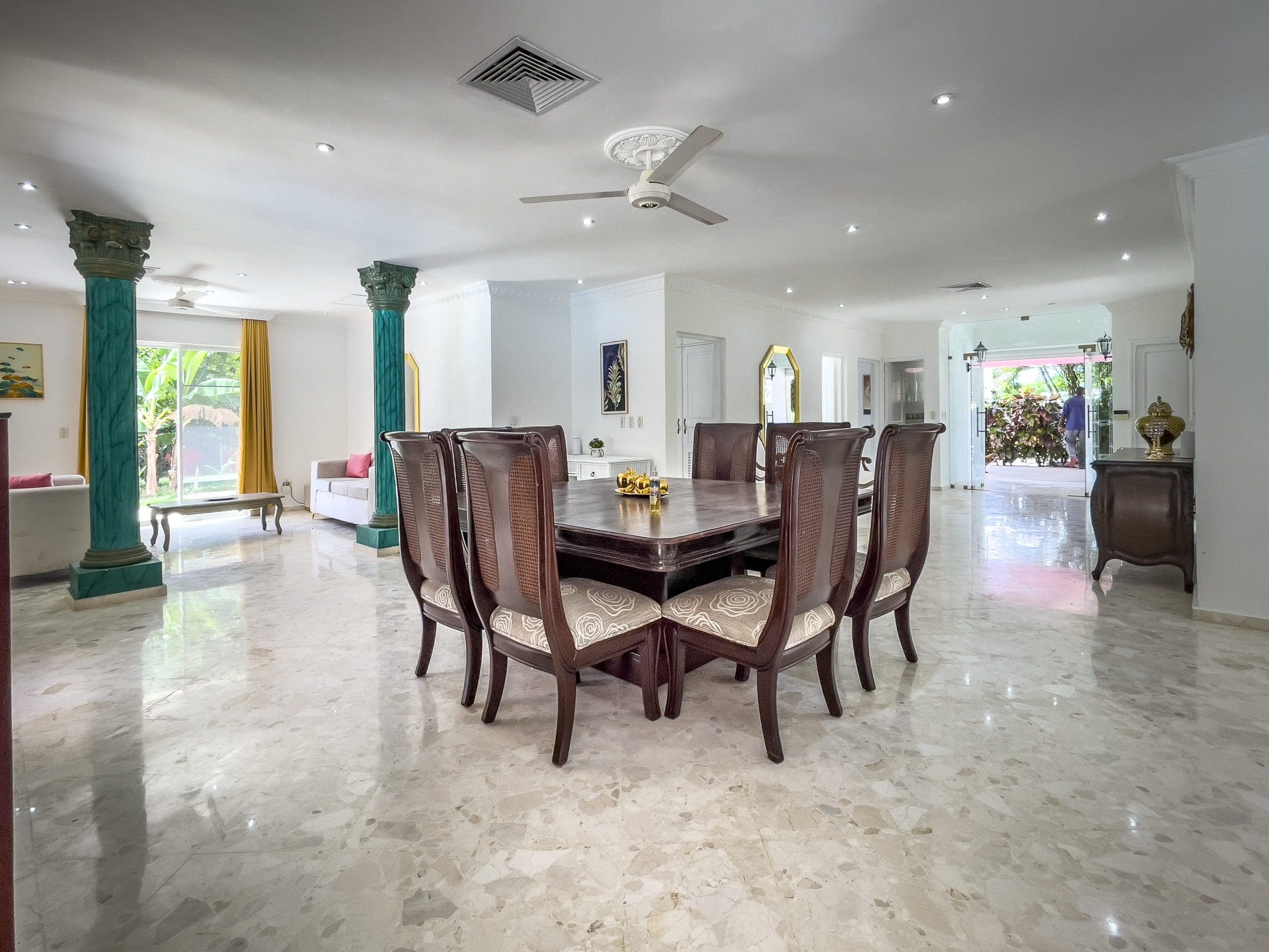 buyDRproperty Spacious dining area in a prime villa for sale, featuring a large table and chairs. Sosua Real Estate