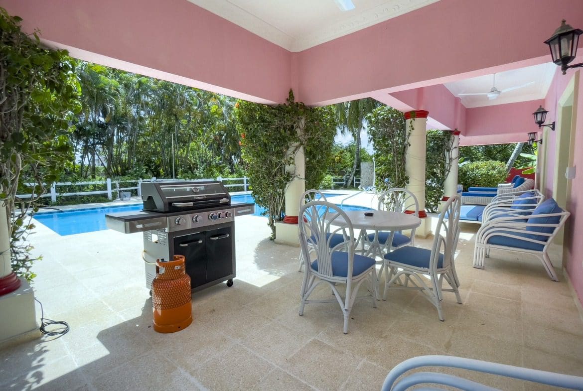 buyDRproperty Outdoor patio with grill, dining area, and pool at a prime villa Sosua Real Estate