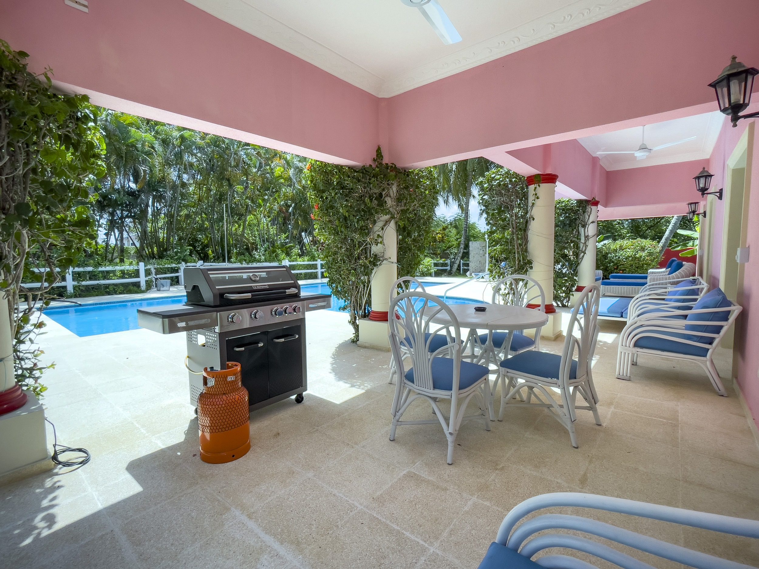 buyDRproperty Outdoor patio with grill, dining area, and pool at a prime villa Sosua Real Estate