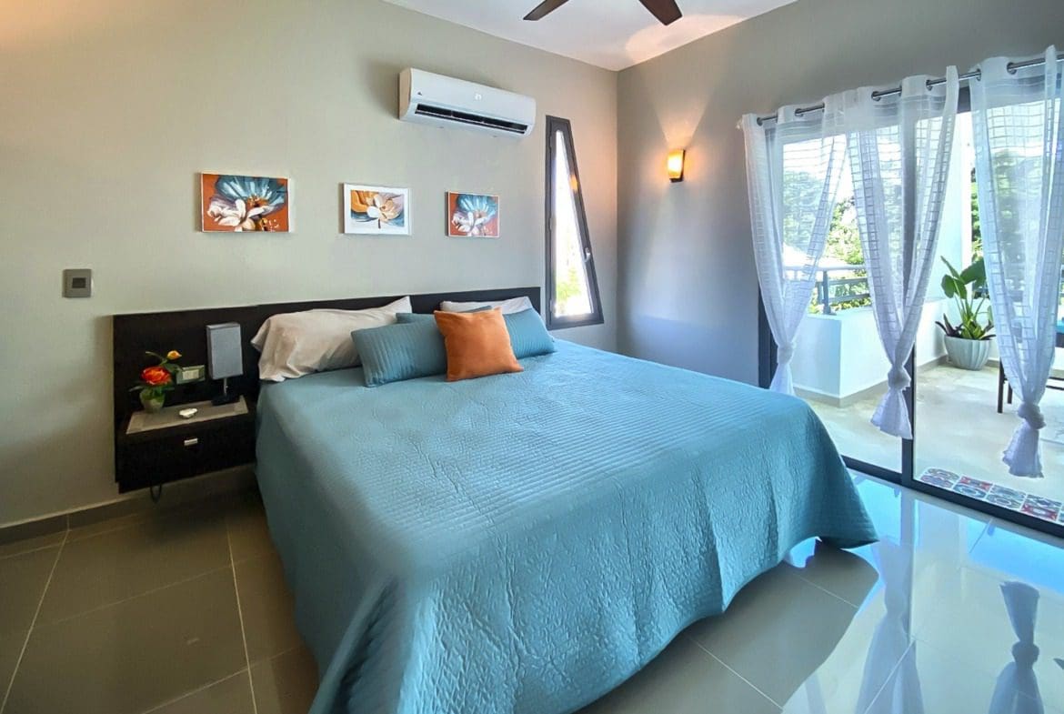 buyDRproperty Modern bedroom in a ProCab penthouse with balcony access. Sosua Real Estate