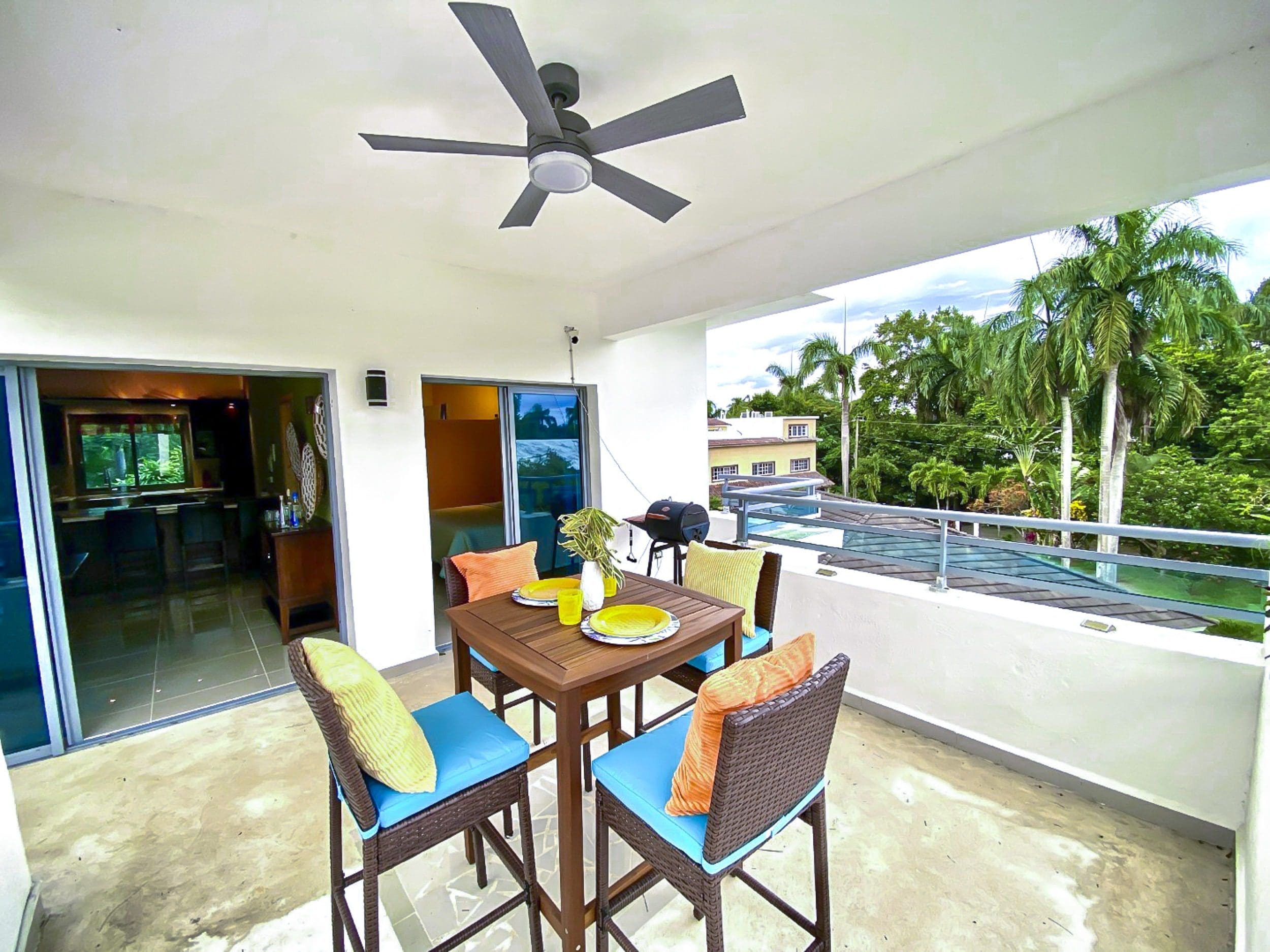 buyDRproperty Outdoor dining area on the balcony of a 2-bedroom penthouse for sale in ProCab. Sosua Real Estate