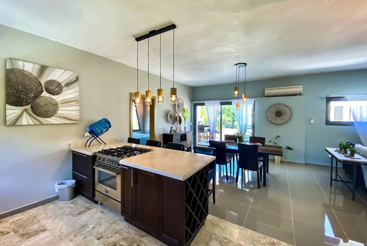 buyDRproperty Modern kitchen and dining area in a ProCab penthouse Sosua Real Estate