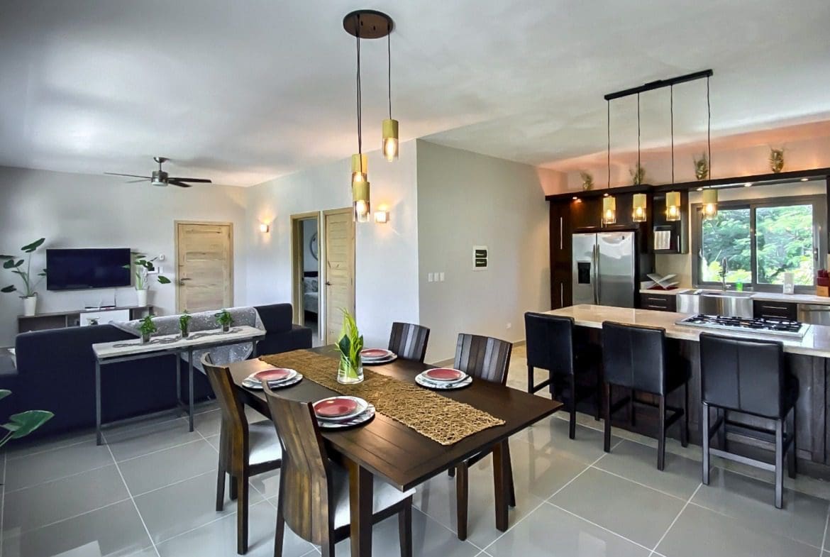 buyDRproperty Modern open-concept living space with dining area and kitchen. Sosua Real Estate
