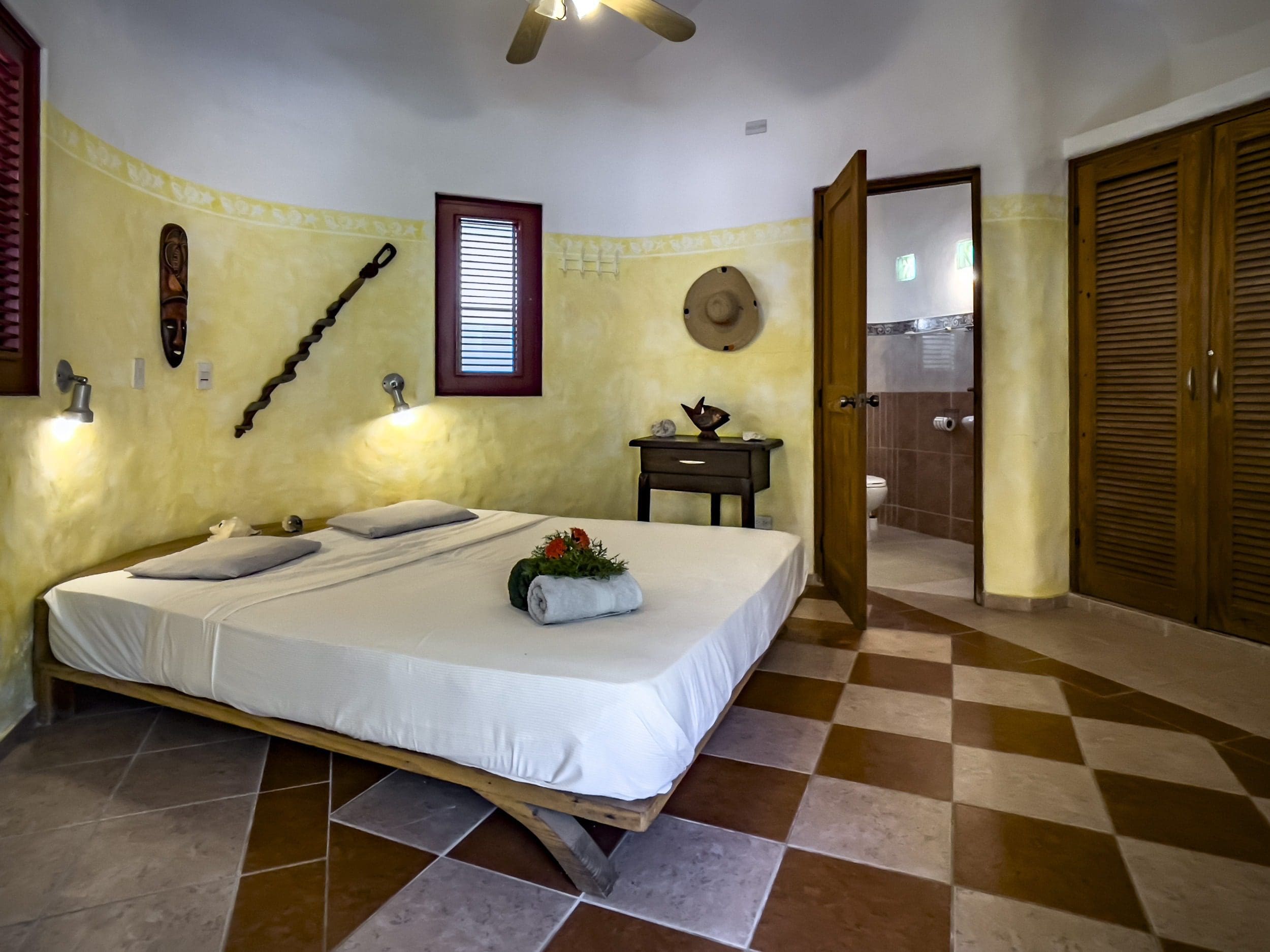 buyDRproperty Charming B&B bedroom with a large bed and rustic decor. Sosua Real Estate
