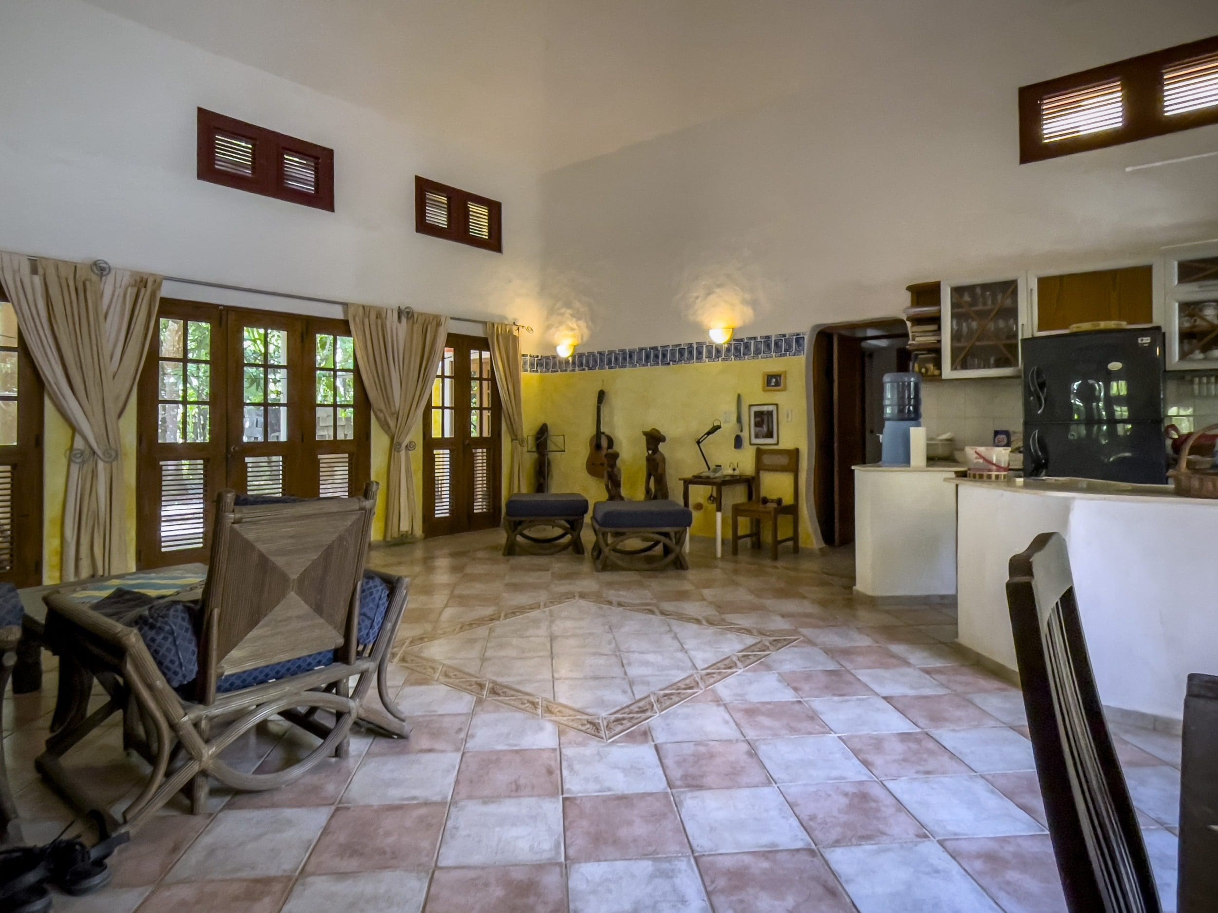 buyDRproperty Charming B&B living area with tiled floors and wooden furniture. Sosua Real Estate