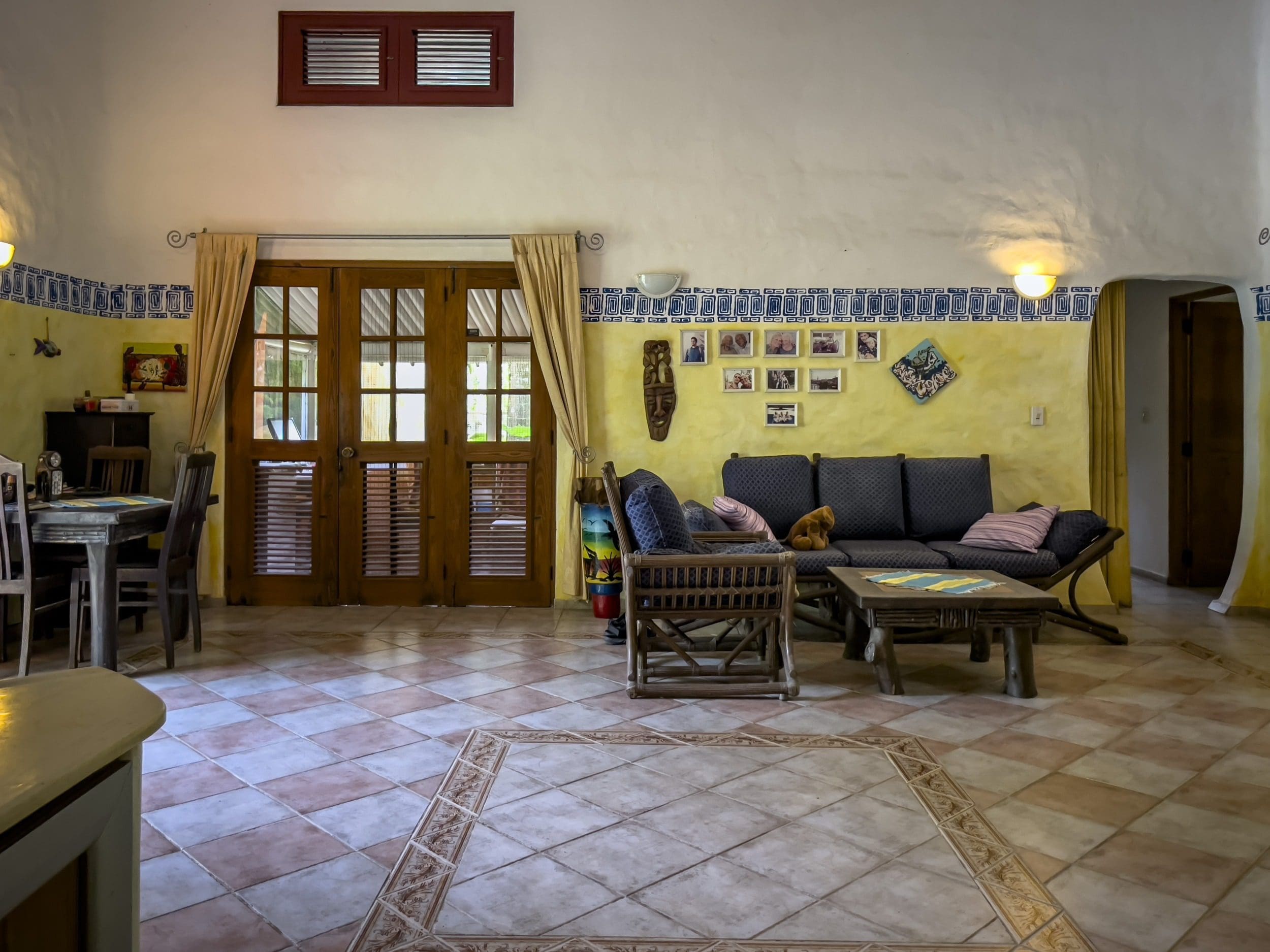 buyDRproperty Cozy B&B living room with wooden furniture and tiled floor Sosua Real Estate