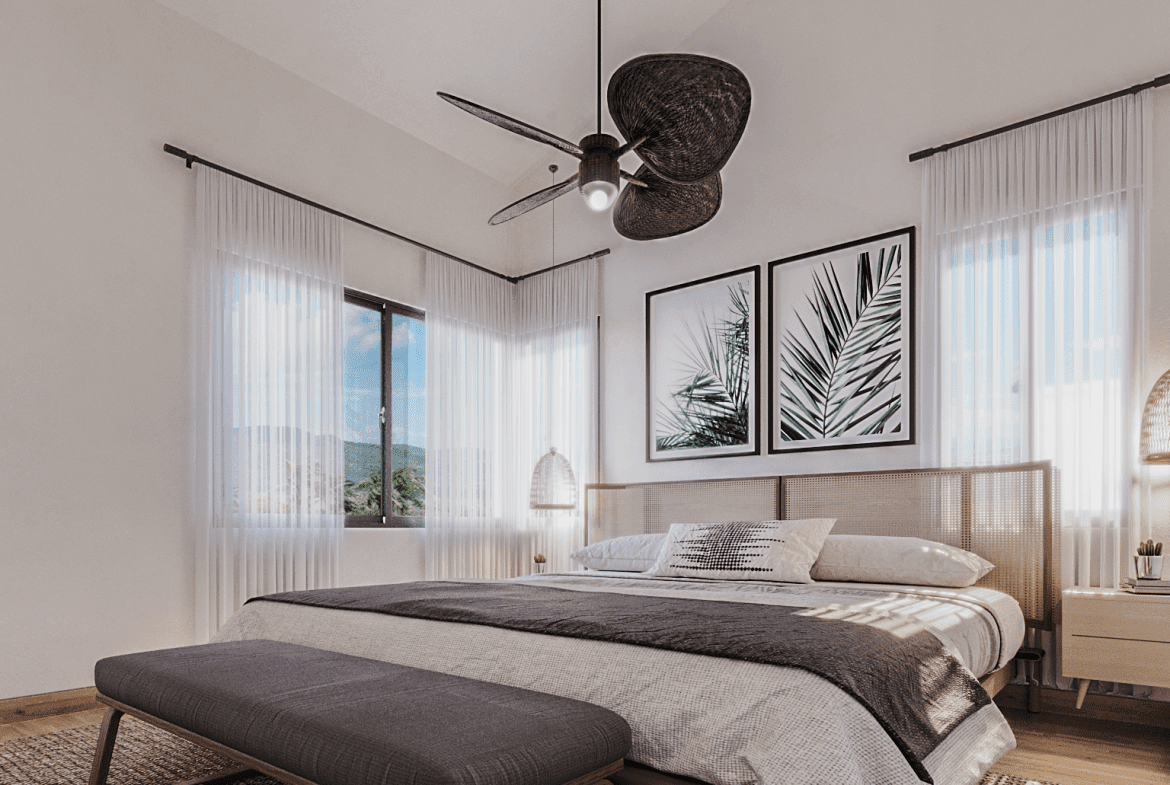 buyDRproperty Bedroom with cane headboard, palm prints, and a ceiling fan; perfect for a bungalow with incredible views. Sosua Real Estate