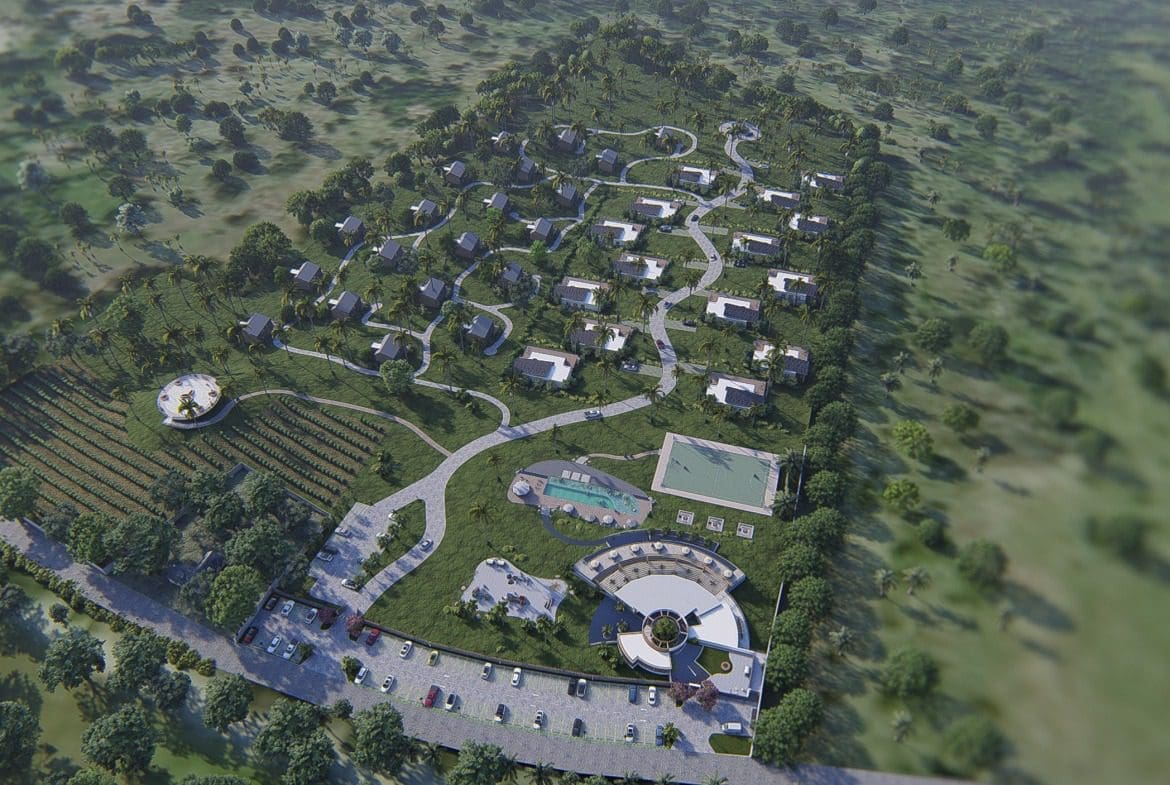 buyDRproperty Aerial view of a resort with villas, a swimming pool, and parking Sosua Real Estate