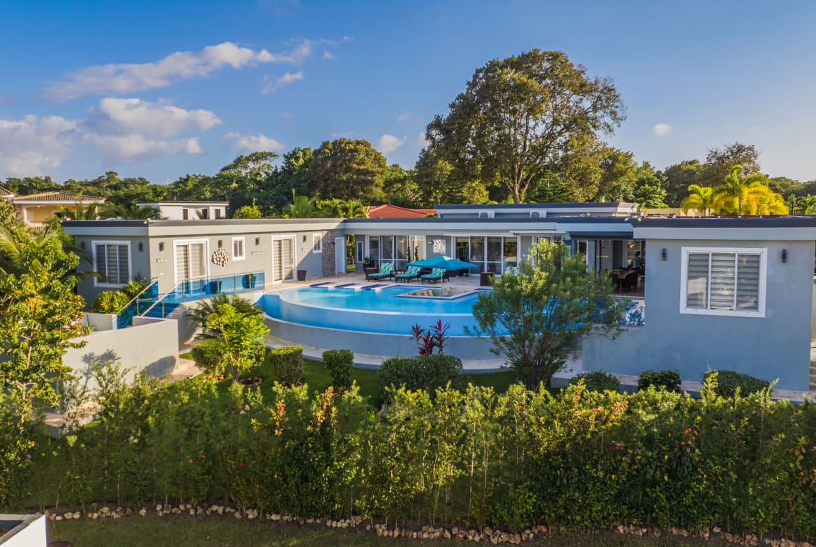 buyDRproperty Luxury 5 BR Villa with pool and lush landscaping Sosua Real Estate