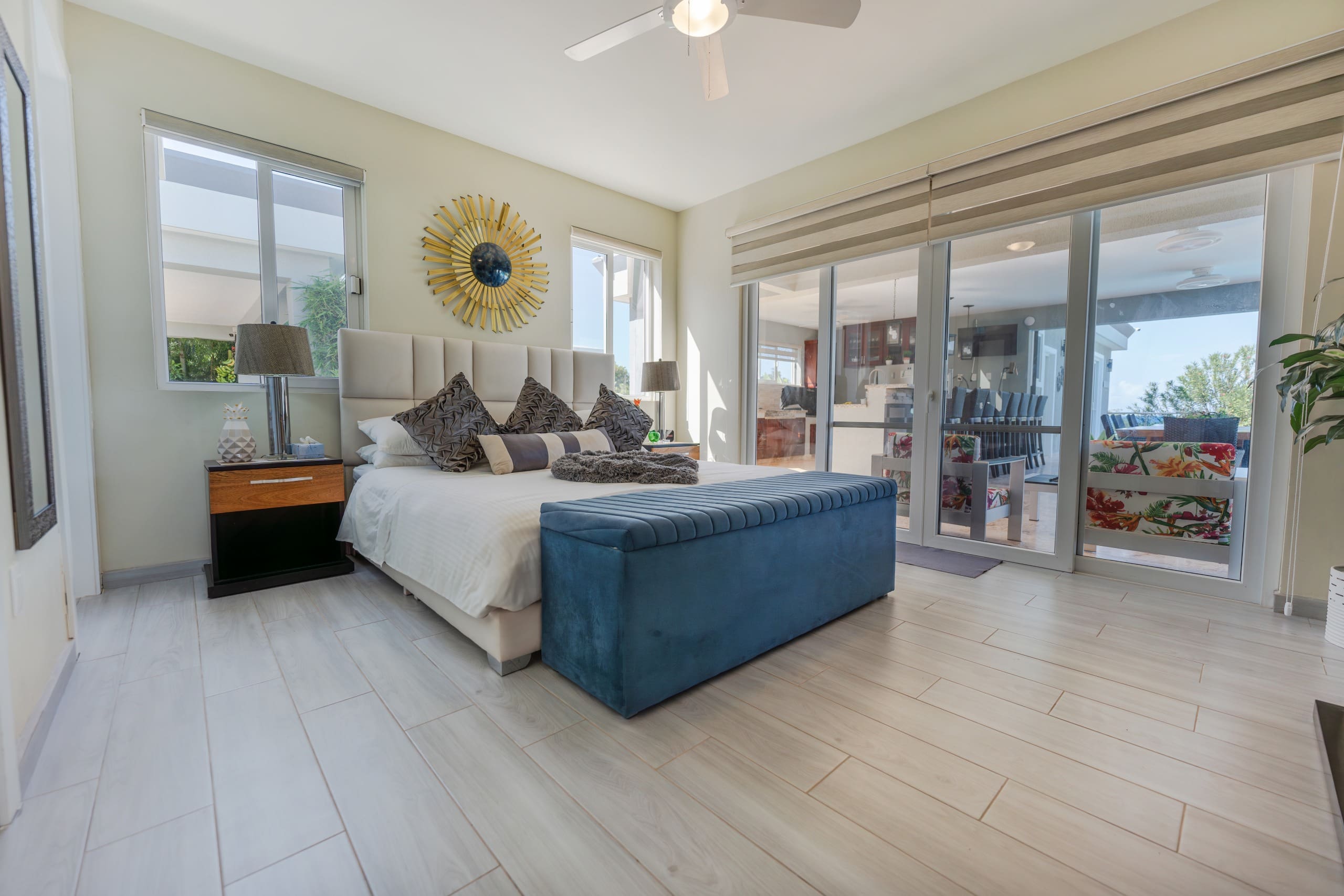 buyDRproperty Luxury bedroom in a 5 BR Luxury Villa with large windows and bright decor. Sosua Real Estate