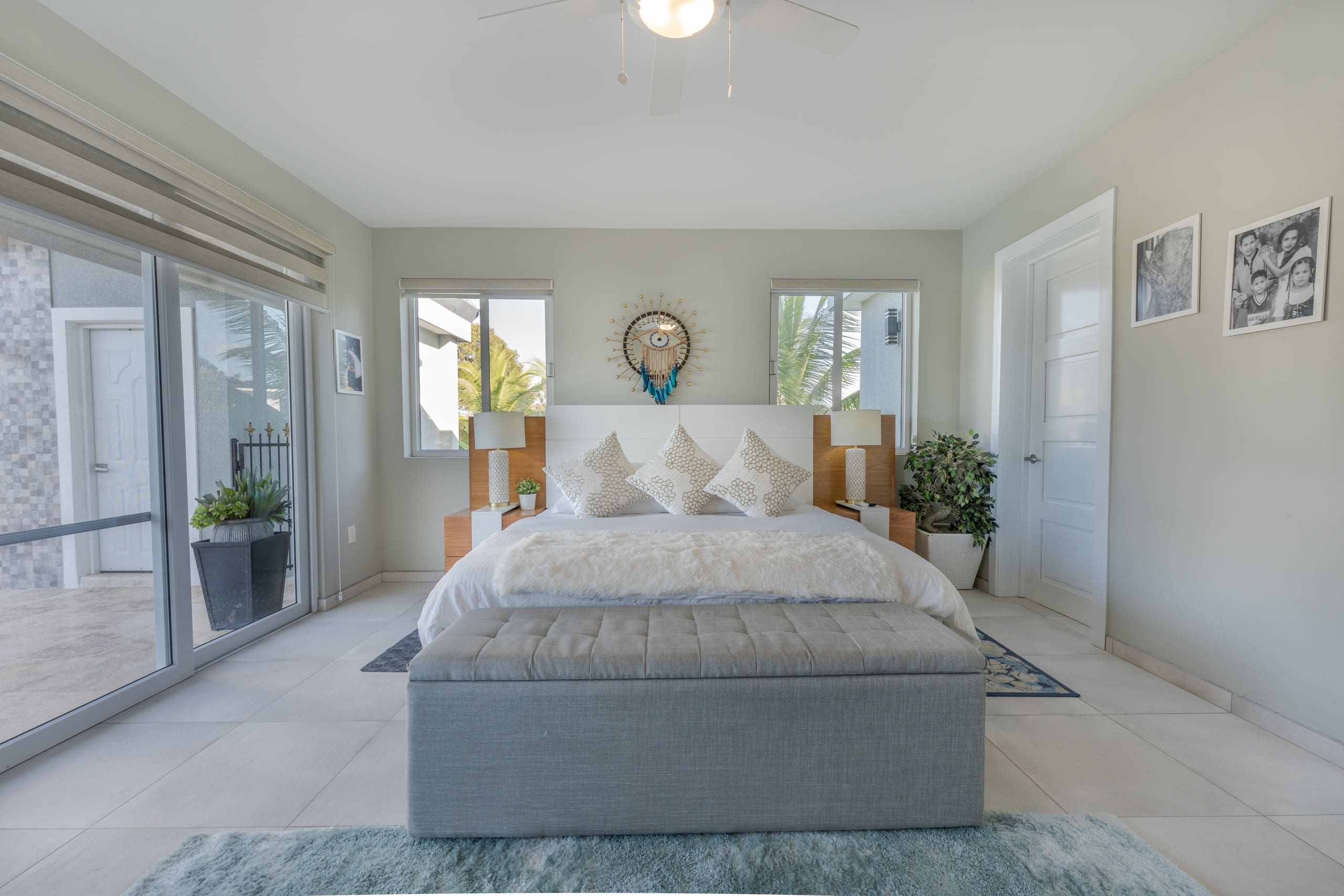buyDRproperty Elegant bedroom in a 5 BR Luxury Villa, featuring a plush rug and large windows. Sosua Real Estate