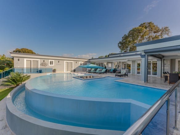 buyDRproperty Luxury 5 BR villa with a large pool and outdoor dining area. Sosua Real Estate