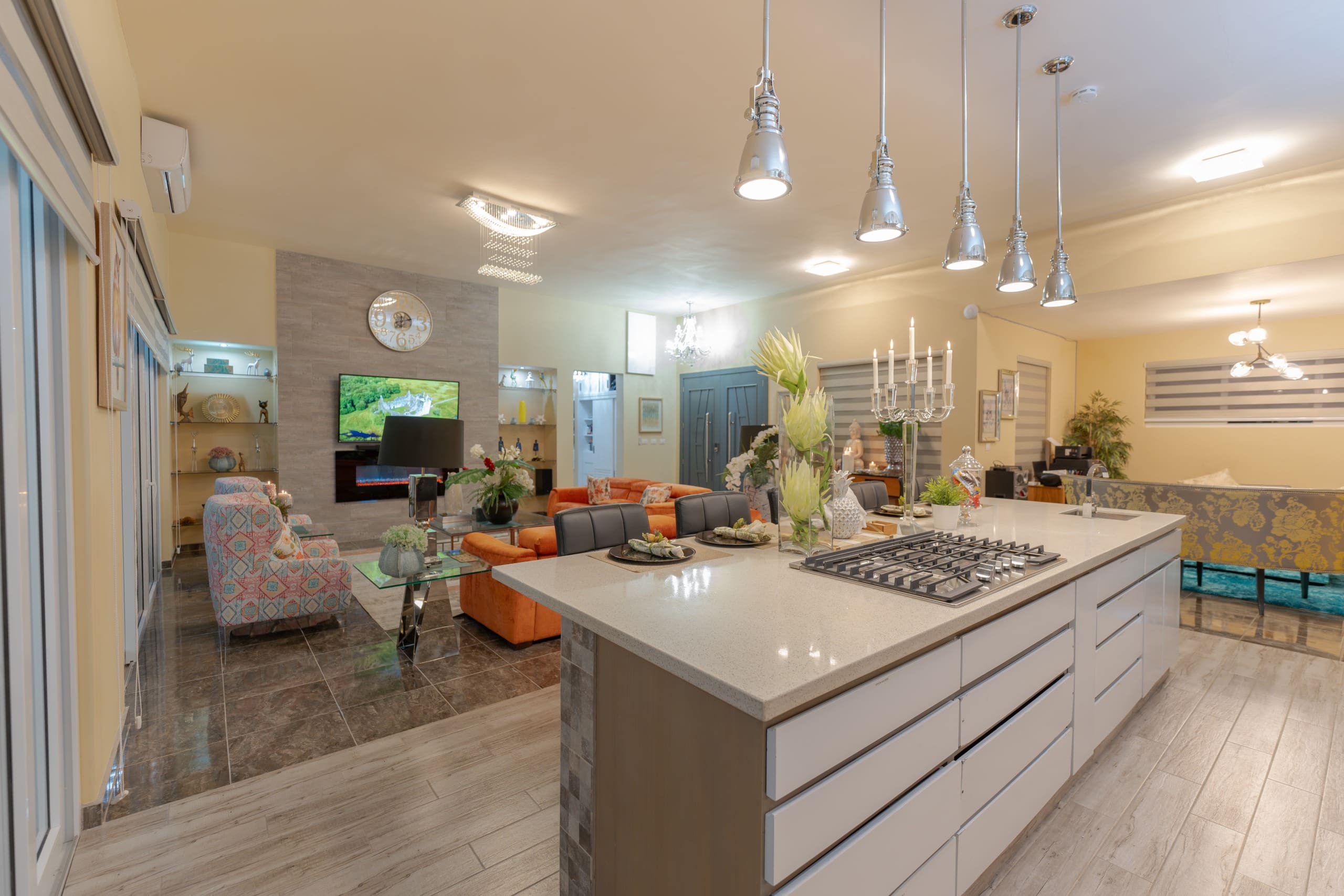 buyDRproperty Luxury kitchen in a 5 BR luxury villa. Modern island with stovetop and pendant lights. Sosua Real Estate