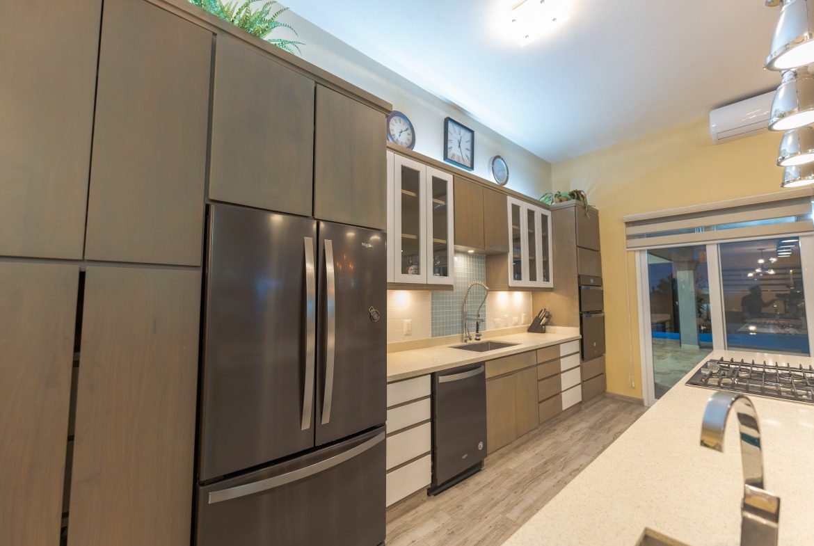 buyDRproperty Modern kitchen in a 5 BR Luxury Villa with stainless steel appliances. Sosua Real Estate