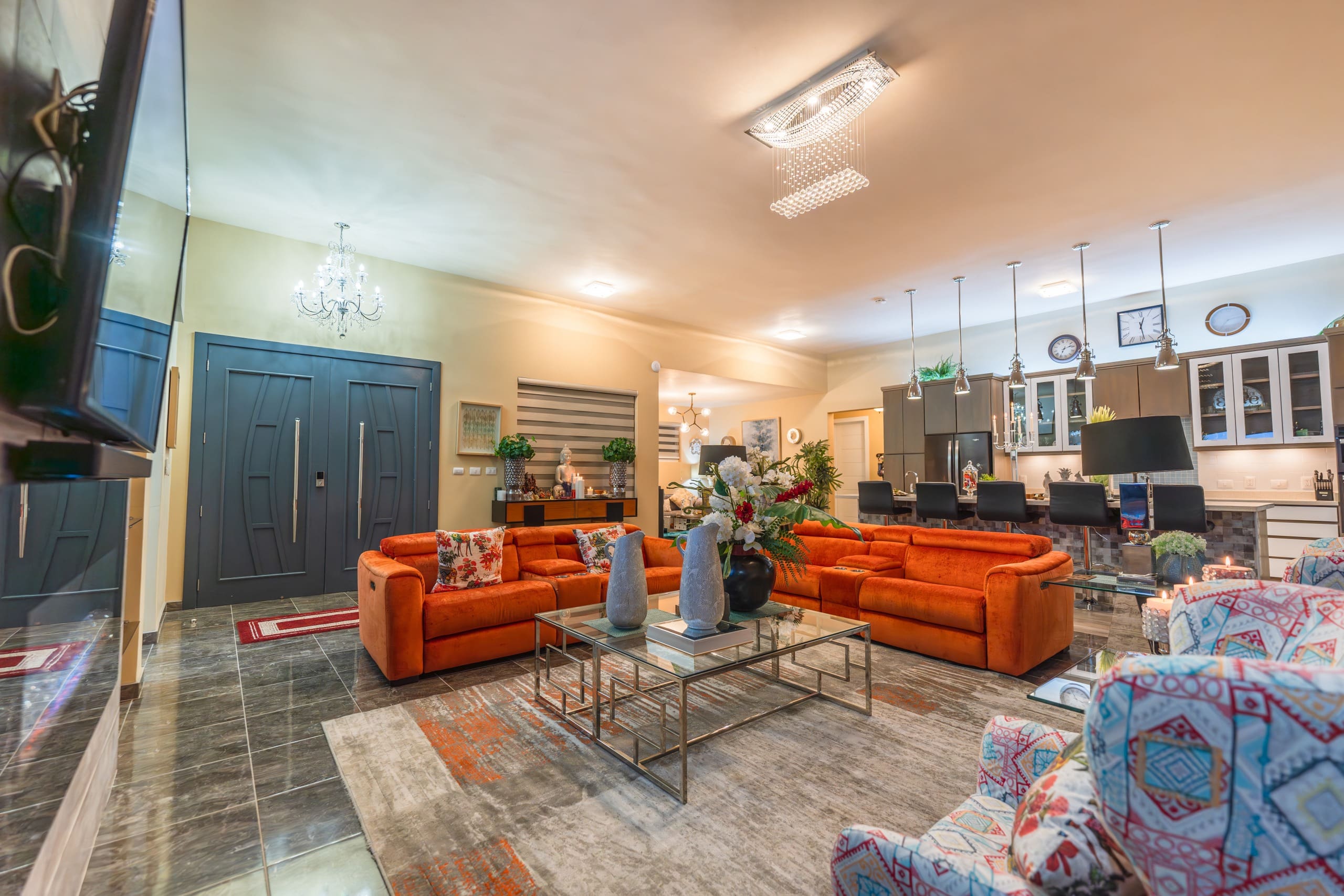 buyDRproperty Luxury living room with orange sofas in a 5 BR Luxury Villa. Sosua Real Estate