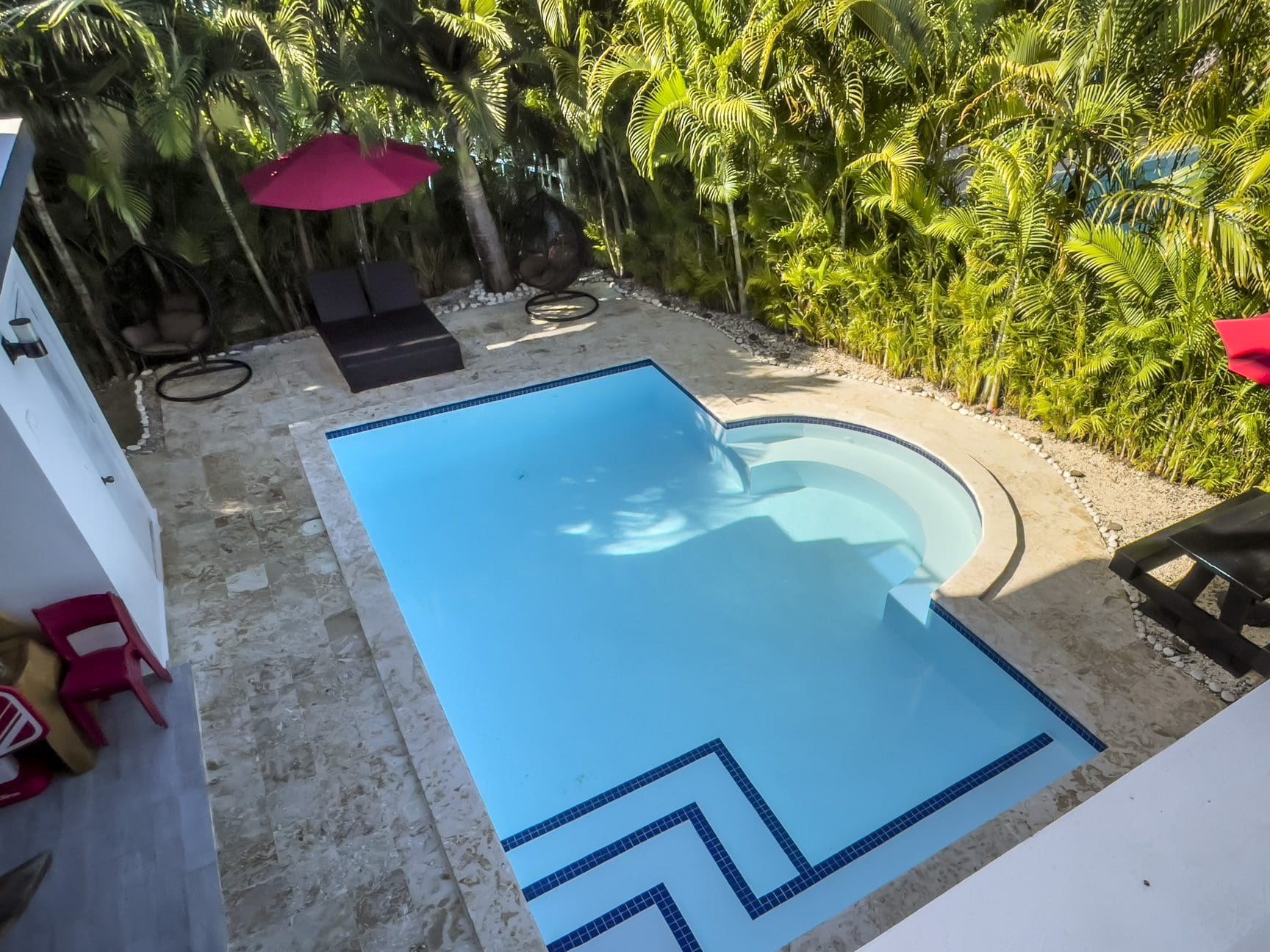 buyDRproperty Luxury Sosúa Ocean Village villa for sale with a private pool and lush tropical landscaping. Sosua Real Estate