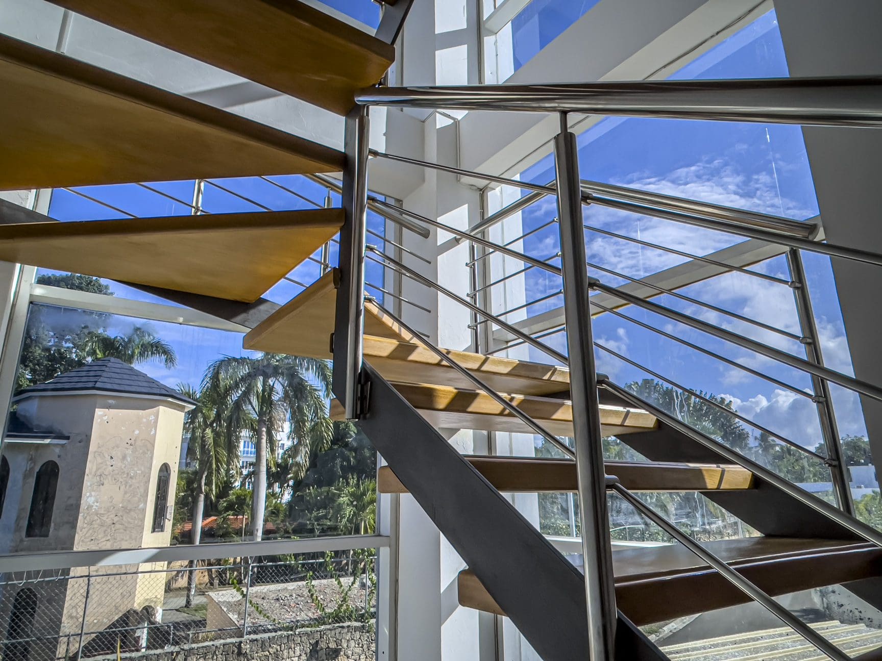 buyDRproperty Modern spiral staircase in a Sosúa Ocean Village villa with a view of the Dominican Republic sky. Sosua Real Estate