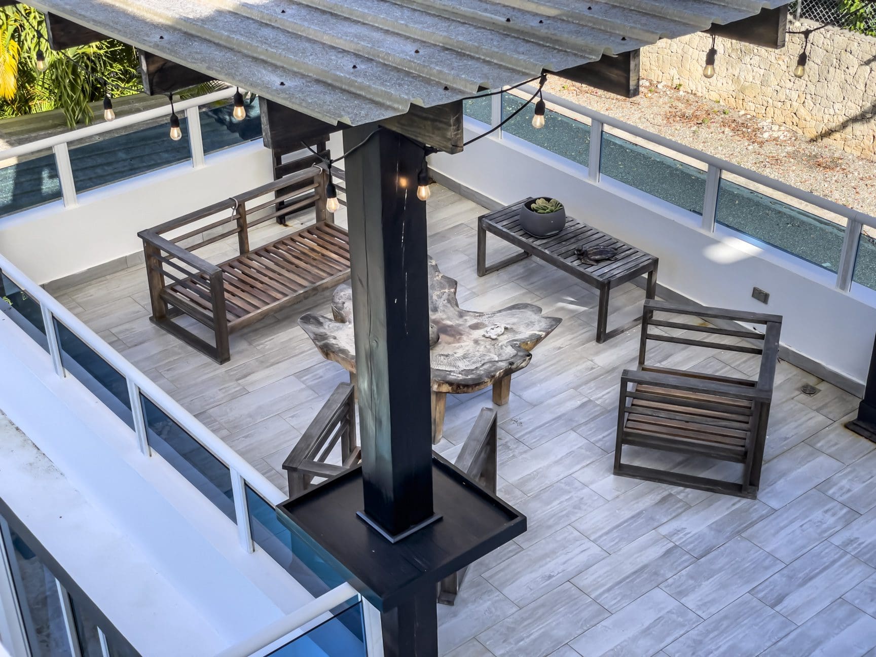 buyDRproperty Rooftop terrace of a 3-bedroom villa for sale in Sosúa Ocean Village, Dominican Republic, with outdoor furniture and ocean views. Sosua Real Estate