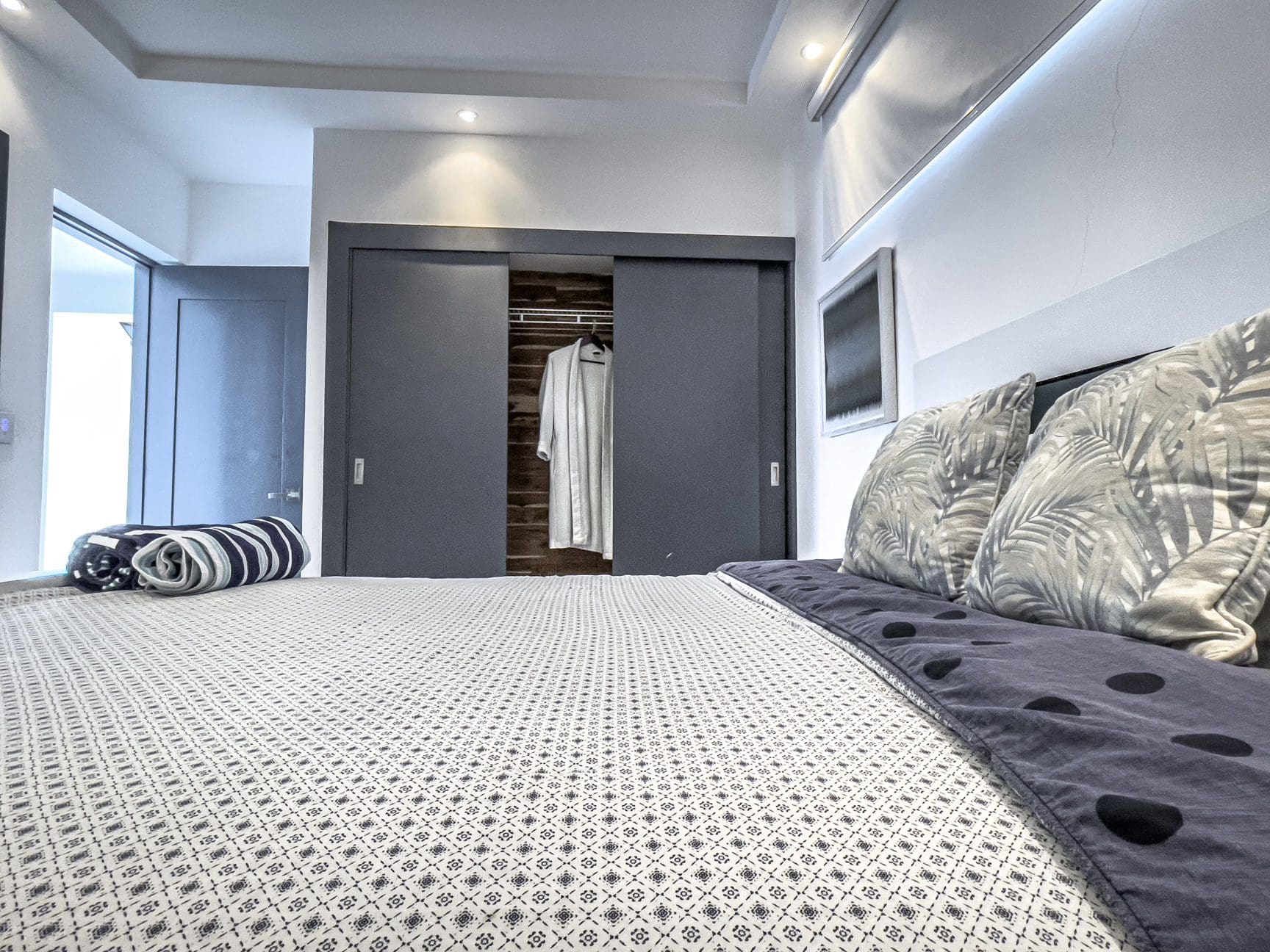 buyDRproperty Modern bedroom in a Sosúa Ocean Village villa for sale with stylish decor. Sosua Real Estate