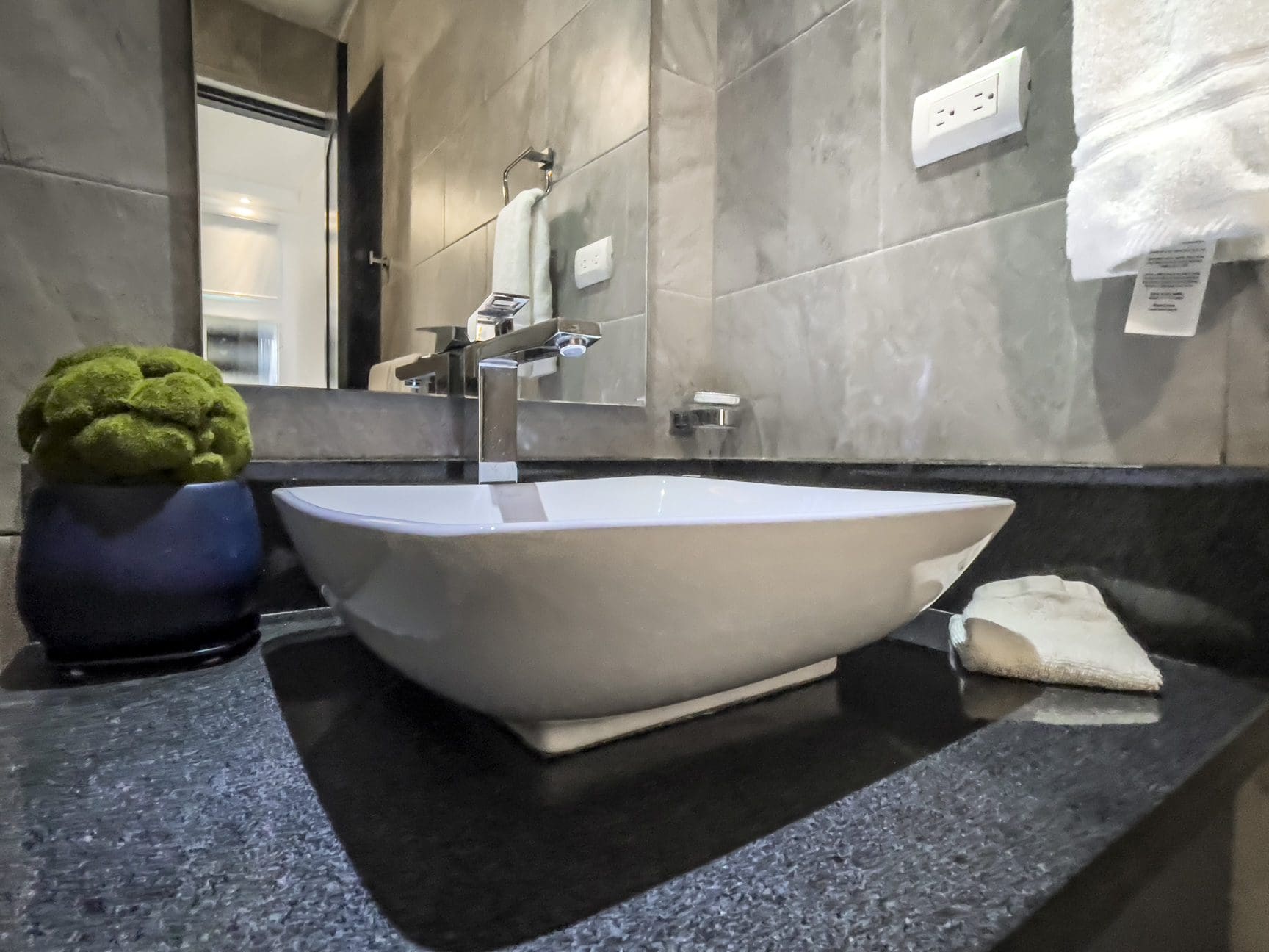 buyDRproperty Modern bathroom vanity with vessel sink in a Sosúa Ocean Village villa for sale. Sosua Real Estate