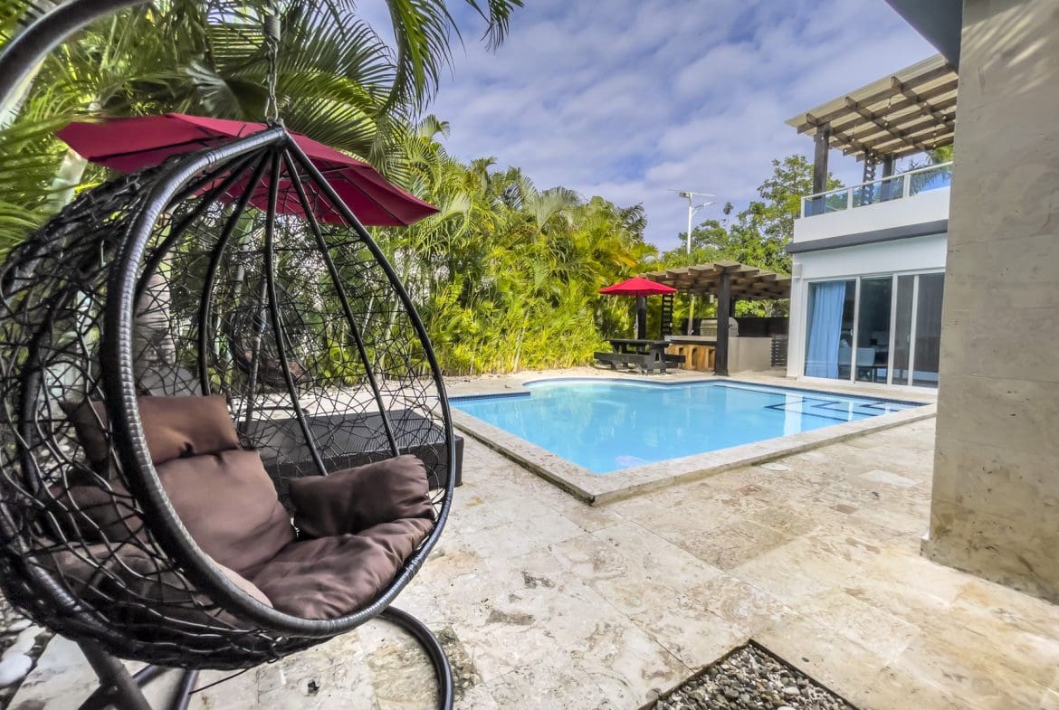 buyDRproperty Sosúa Ocean Village villa for sale: Modern 3-bedroom villa with pool and outdoor seating area. Sosua Real Estate