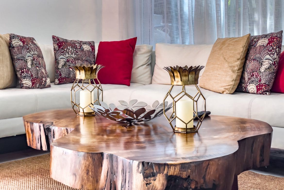 buyDRproperty Living room in a modern Sosúa Ocean Village villa with a wooden coffee table and stylish decor. Sosua Real Estate