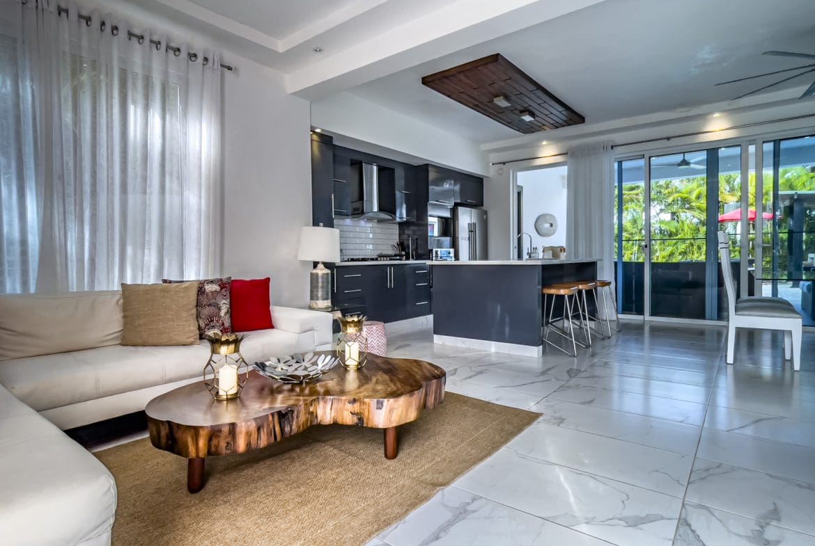 buyDRproperty Modern living room in a 3-bedroom villa for sale in Sosúa Ocean Village, Dominican Republic. Sosua Real Estate