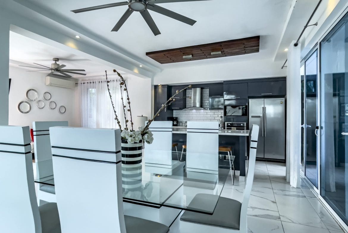 buyDRproperty Modern Sosúa Ocean Village villa for sale with dining area and kitchen Sosua Real Estate
