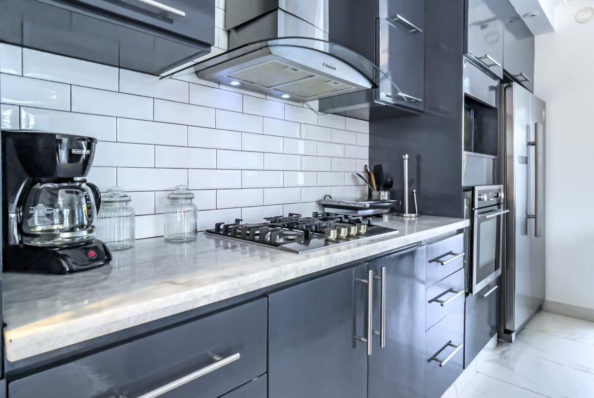 buyDRproperty Modern kitchen in a 3-bedroom villa for sale in Sosúa Ocean Village, Dominican Republic. Sosua Real Estate
