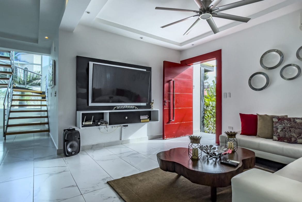Bright open-concept living room in Sosua Ocean Village villa".