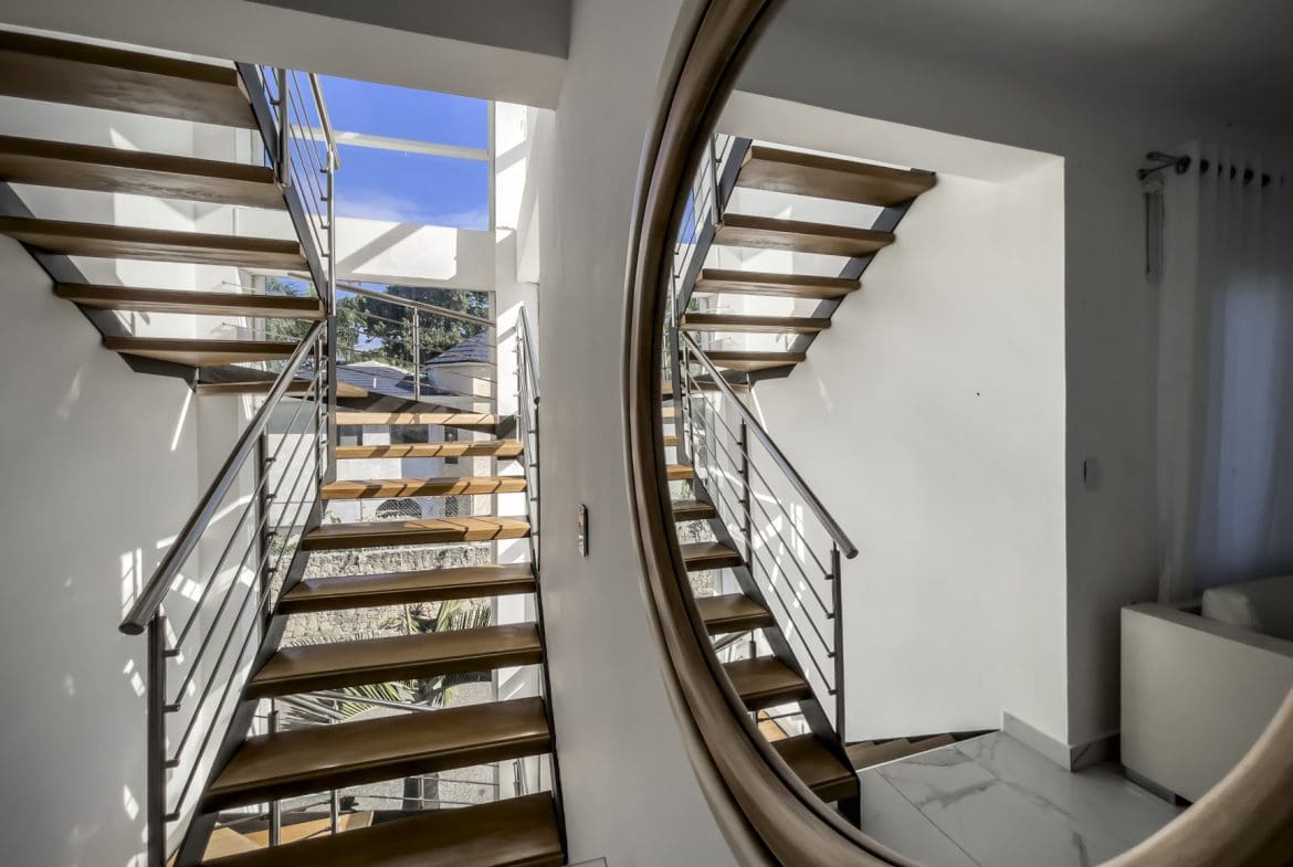 buyDRproperty Modern staircase in a Sosúa Ocean Village villa for sale. 3-bedroom villa with ocean views. Sosua Real Estate