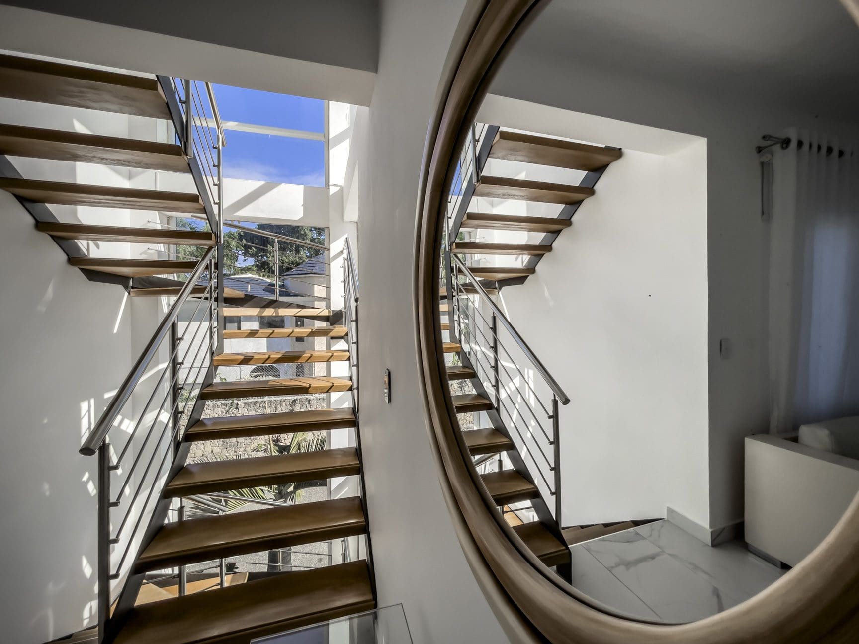 buyDRproperty Modern staircase in a Sosúa Ocean Village villa for sale. 3-bedroom villa with ocean views. Sosua Real Estate