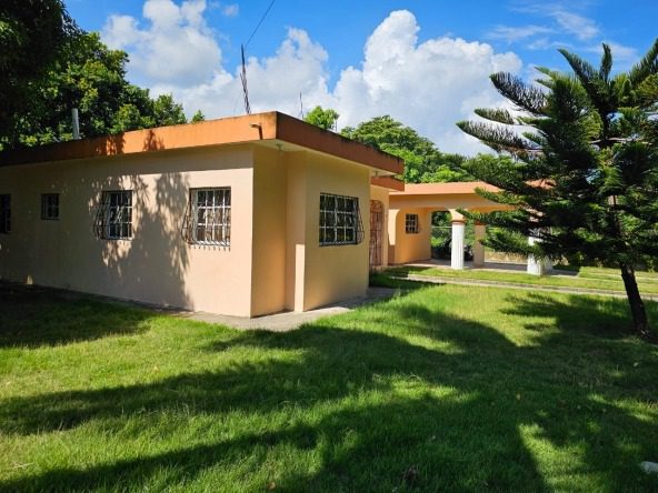 Buydrproperty Charming House in Cabarete for Sale Exterior View with Lush Green Lawn Sosua Real Estate Buydrpropertycom Buydrpropertycom