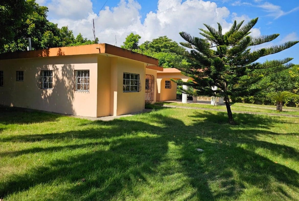 buyDRproperty Charming house for sale in Cabarete, Dominican Republic, with lush green lawn Sosua Real Estate