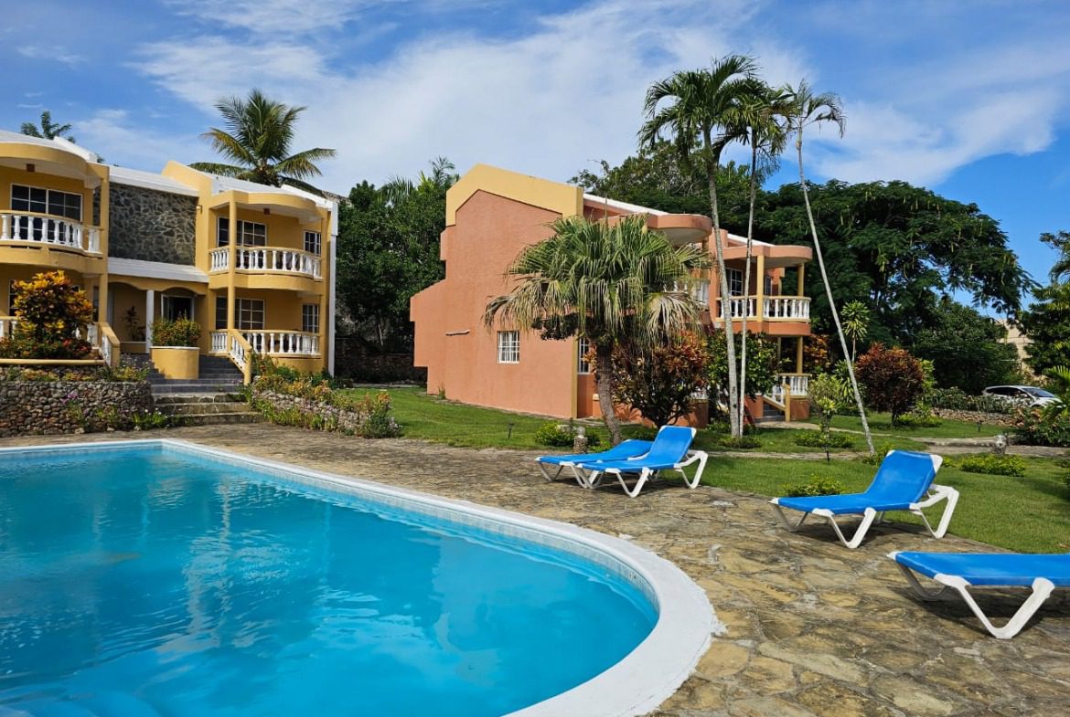 buyDRproperty Tropical resort with pool and lounge chairs, a great place to relax. Sosua Real Estate