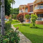 Buydrproperty Townhouse for Sale Close to Sosua Center with Green Lawns and a Stone Pathway Sosua Real Estate Buydrpropertycom Buydrpropertycom