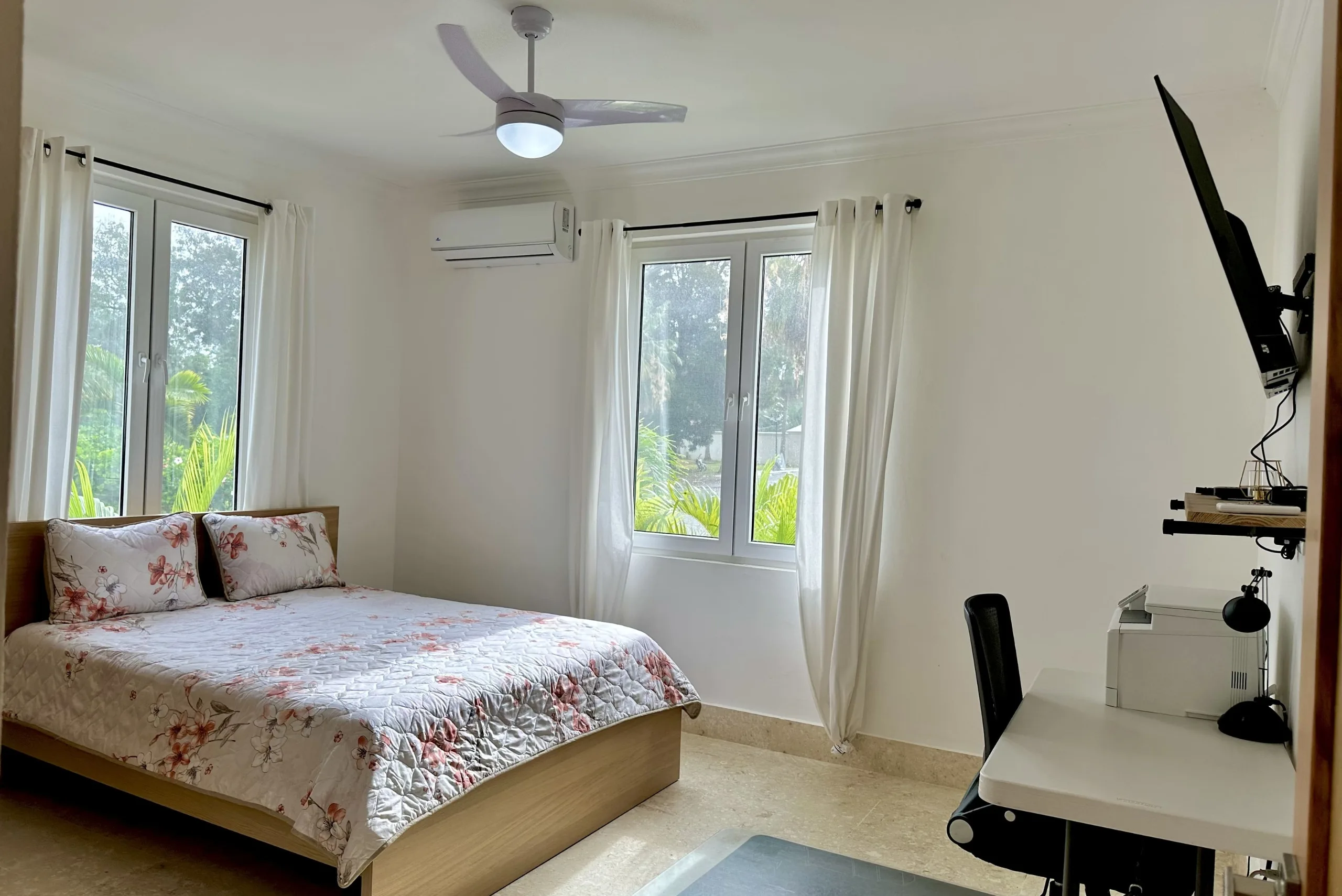 buyDRproperty Bedroom in a 2-Bedroom Condo with bed, windows, and desk Sosua Real Estate