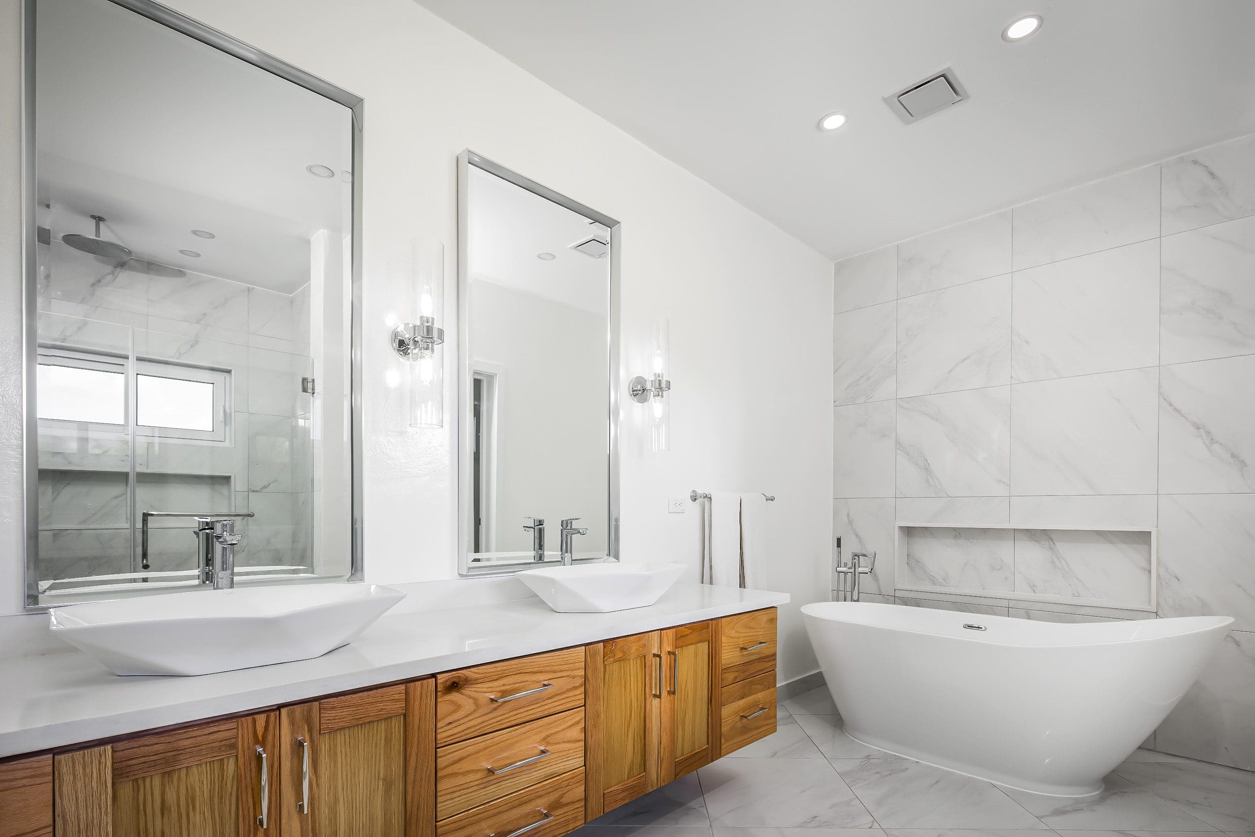 buyDRproperty Modern bathroom with double vanity and freestanding tub in a Casa Linda villa for sale. Sosua Real Estate